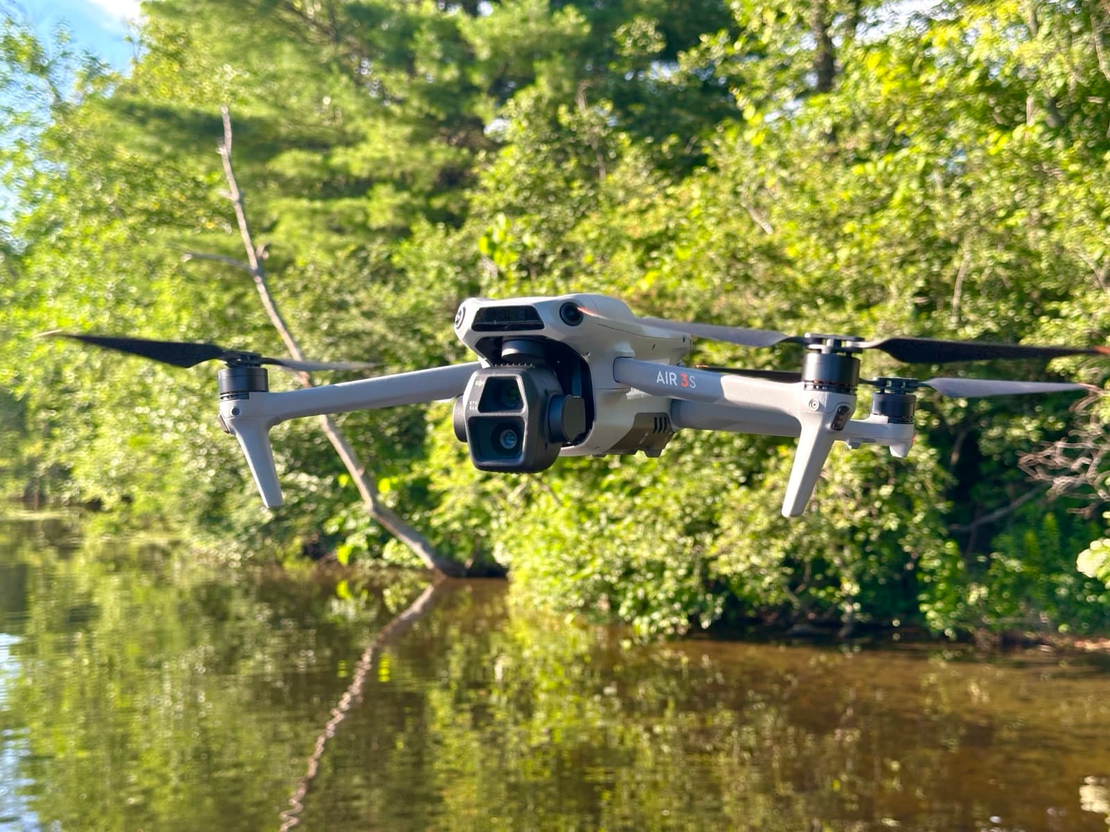 DJI Air 3S drone, close-up studio photo of the dual-camera gimbal